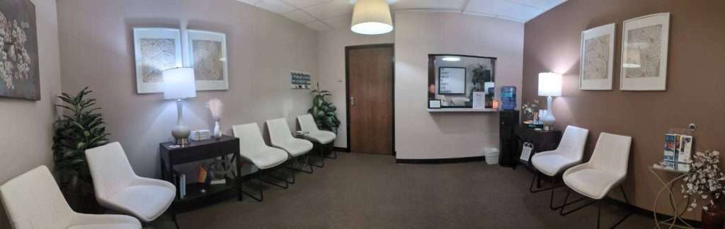 a room with chairs and a door